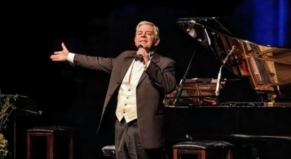Tenor Roy Best singing on stage