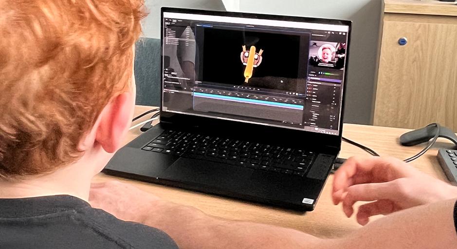 A young boy working on a computer