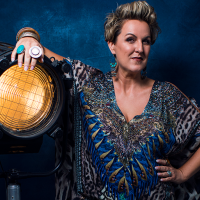 Queenie Van De Zandt leans on a great big light! She's looking pretty cool too. 