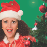 Gina Hogan posing with christmas tree