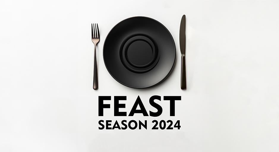 A black plate, knife and fork on a white background.