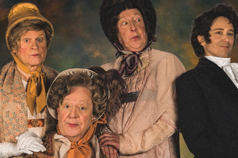 Four characters in old fashioned costumers to perform in Pride In Prejudice