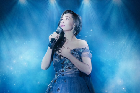 Clare Lyon sings in spotlight