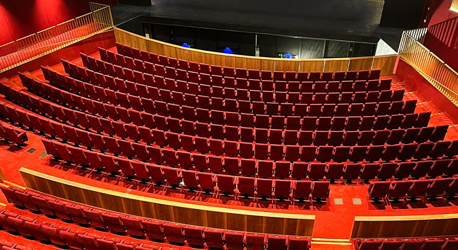 View of The Round theatre from above, looking over seats towards the stage