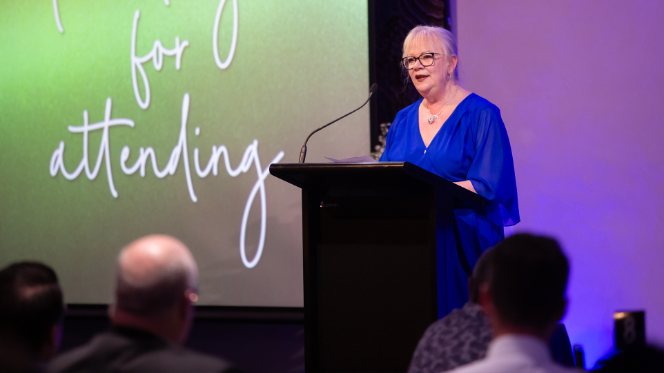 A woman at a lectern