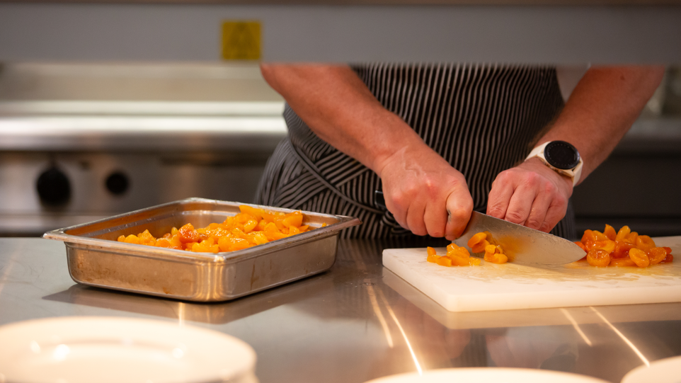 A chef preparing food.