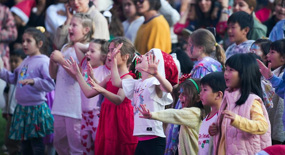 Children enjoy Whitehorse Carols outside The Round Soundshell. 