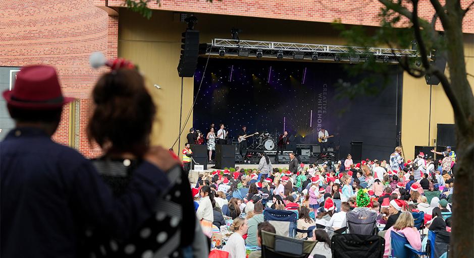 A large crowd attends the Whitehorse Carols event in 2023 using The Round soundshell