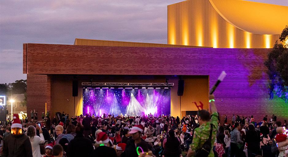 A large crowd attends the Whitehorse Carols event in 2023 using The Round soundshell