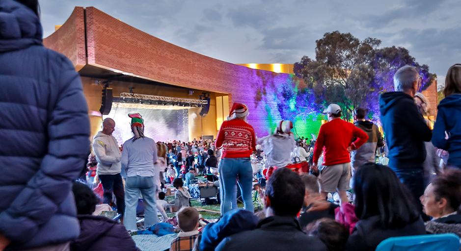 A large crowd attends the Whitehorse Carols event in 2023 using The Round soundshell