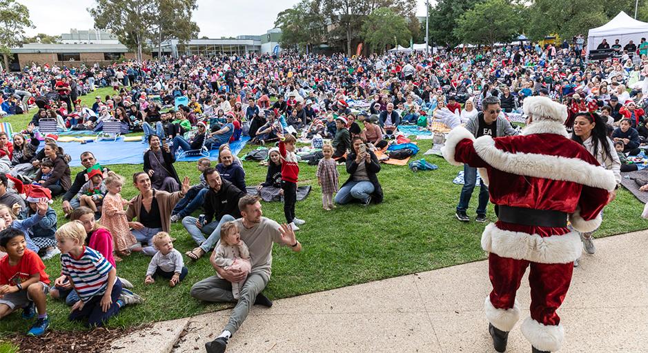 A large crowd attends the Whitehorse Carols event in 2023 using The Round soundshell