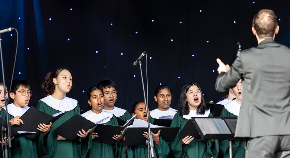 Performers on stage during the Whitehorse Carols, at The Round Soundshell. 